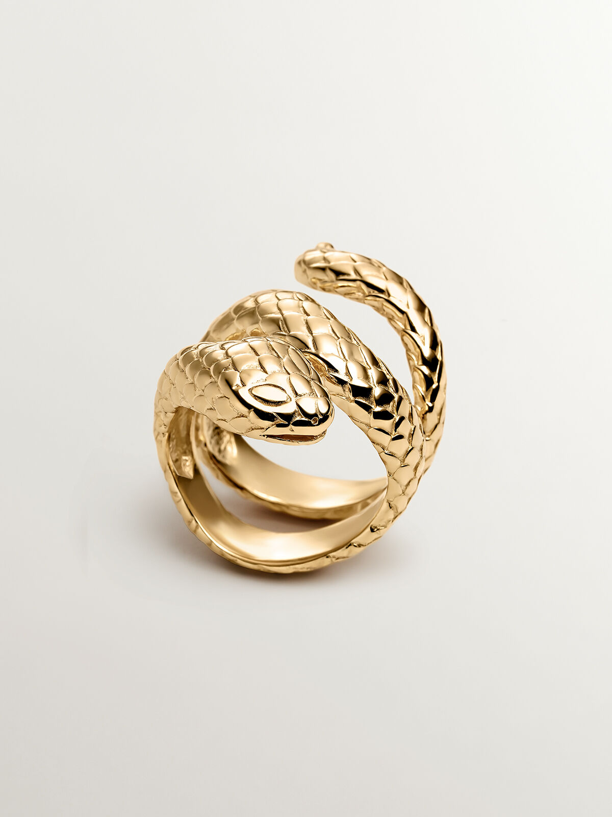 Wide 925 silver ring bathed in 18K yellow gold in the shape of a 