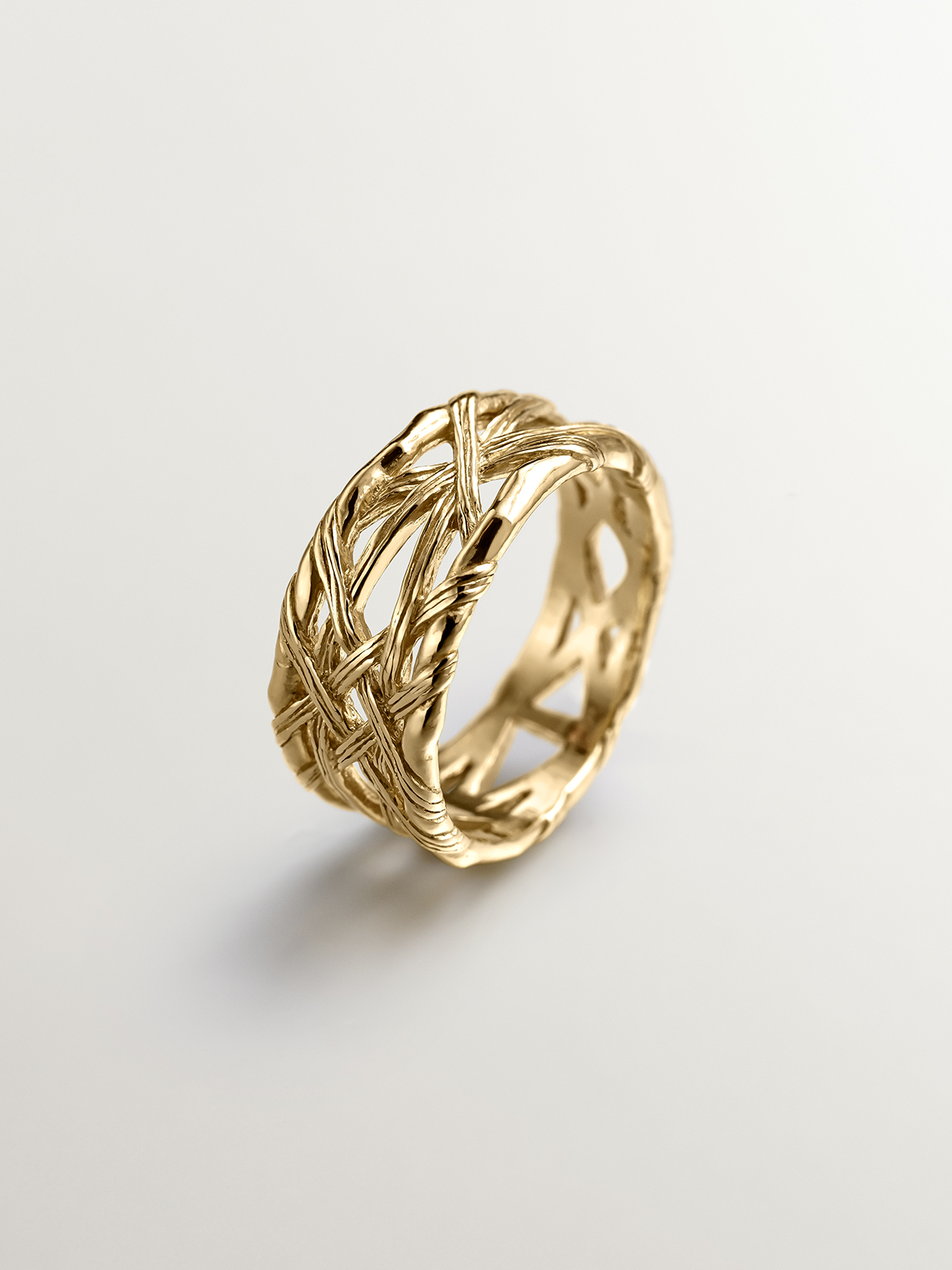 925 Silver ring bathed in 18K yellow gold with wicker texture.
