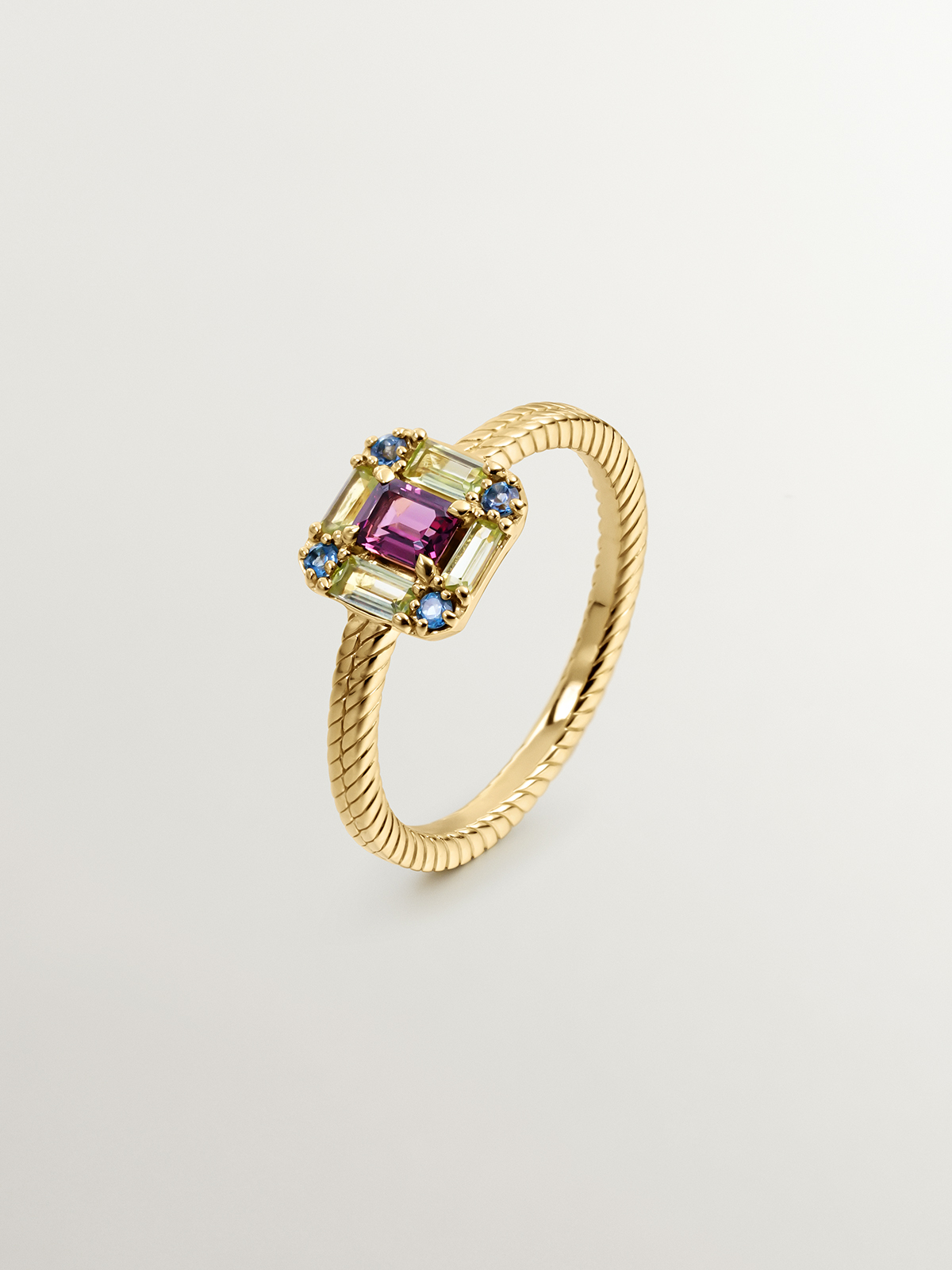 929 Silver ring bathed in 18K yellow gold with rhodolite, peridot, and topaz.