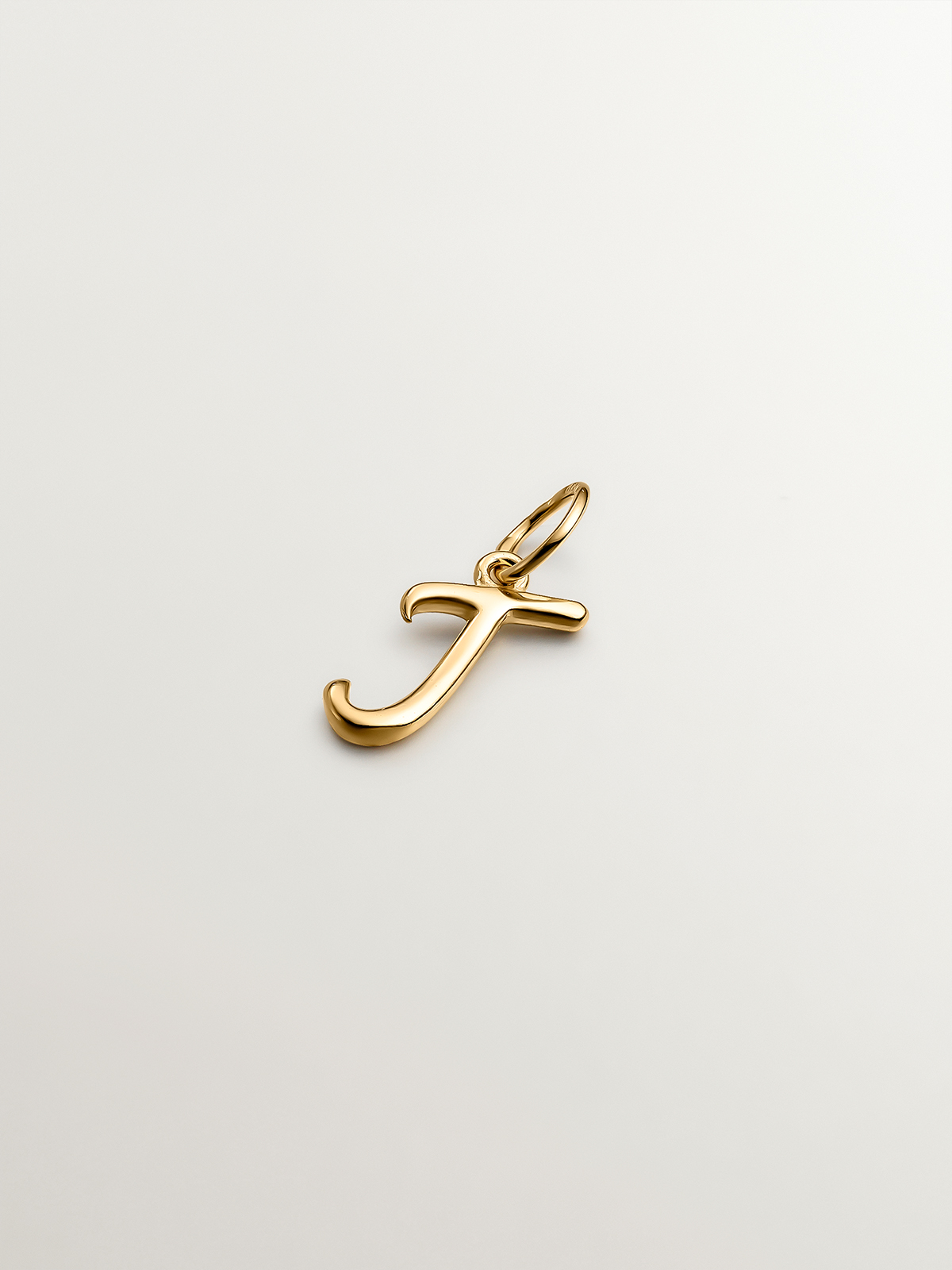 925 Silver charm bathed in 18K yellow gold with initial J.