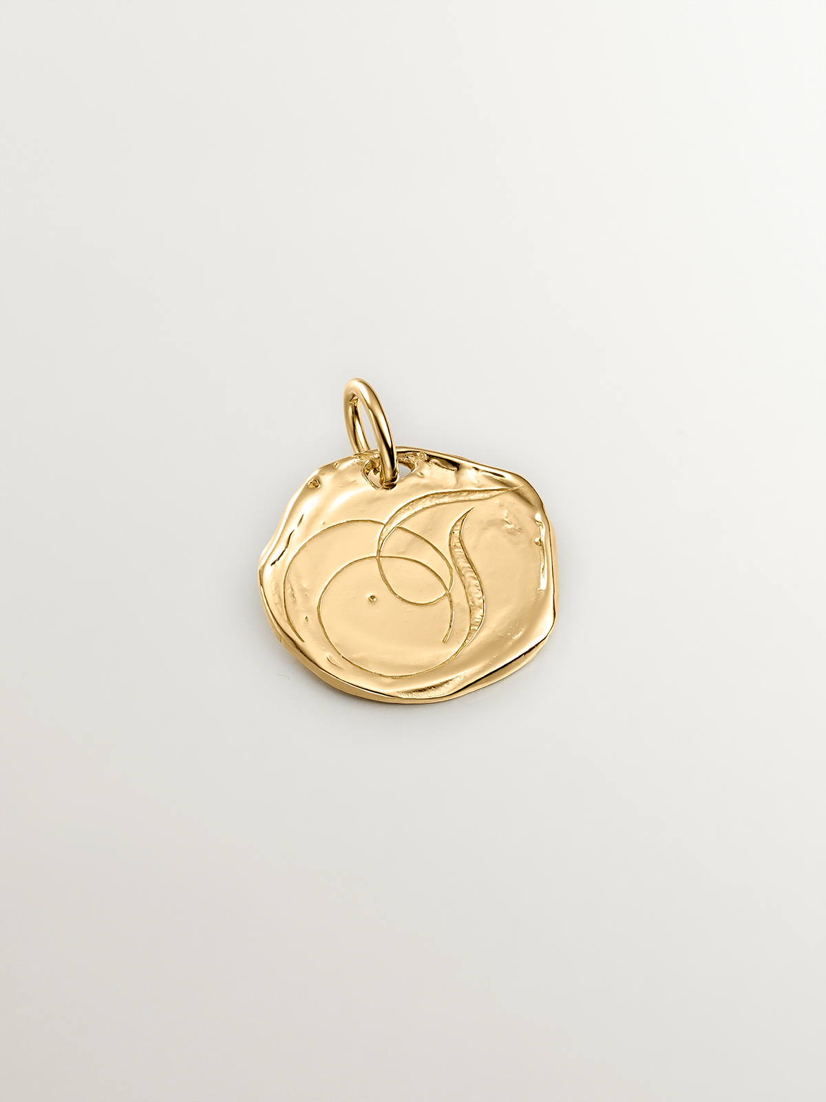 Handcrafted 925 silver charm plated in 18K yellow gold with initial T.