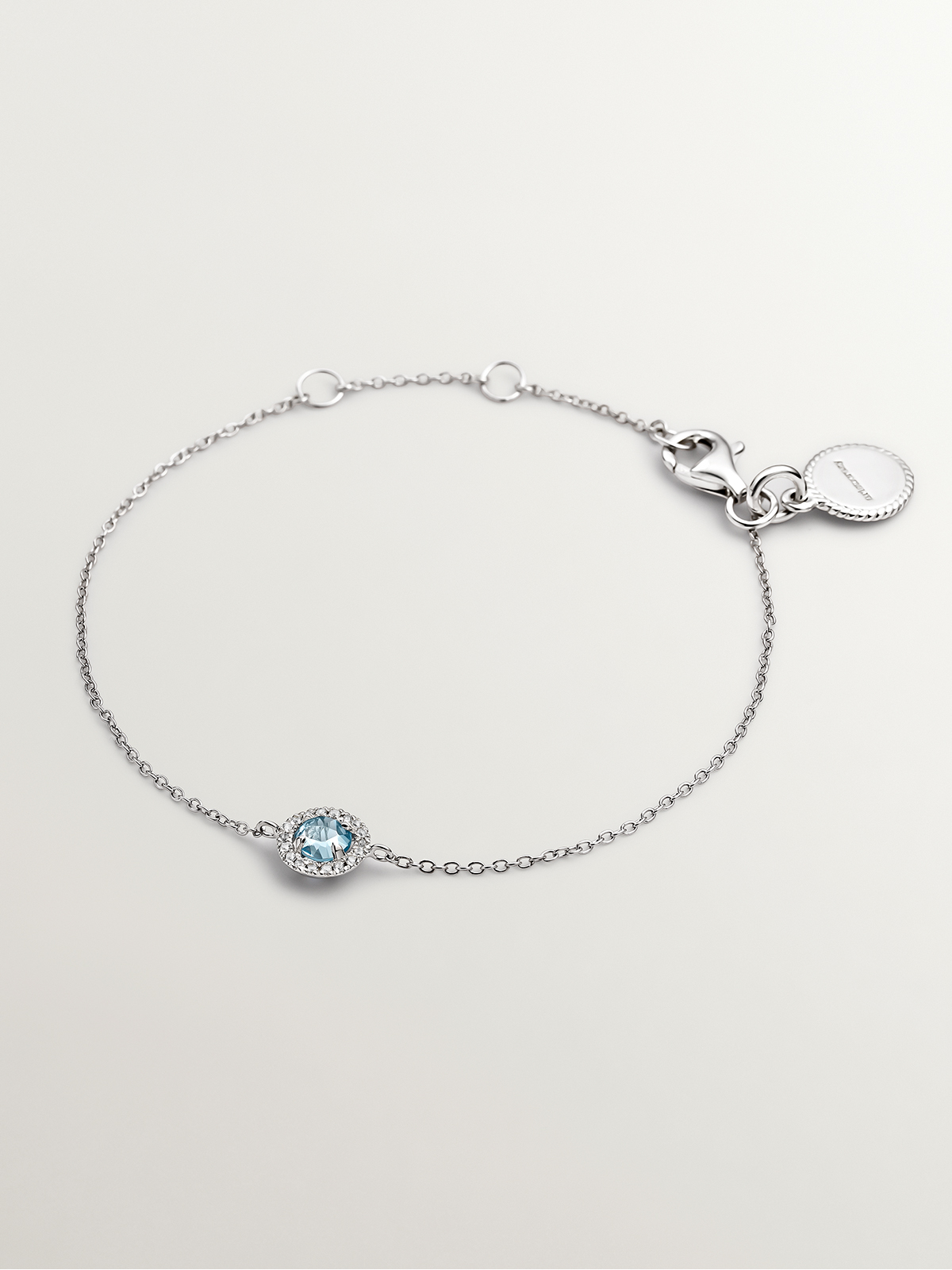 925 Silver bracelet with white sapphires and blue topaz.