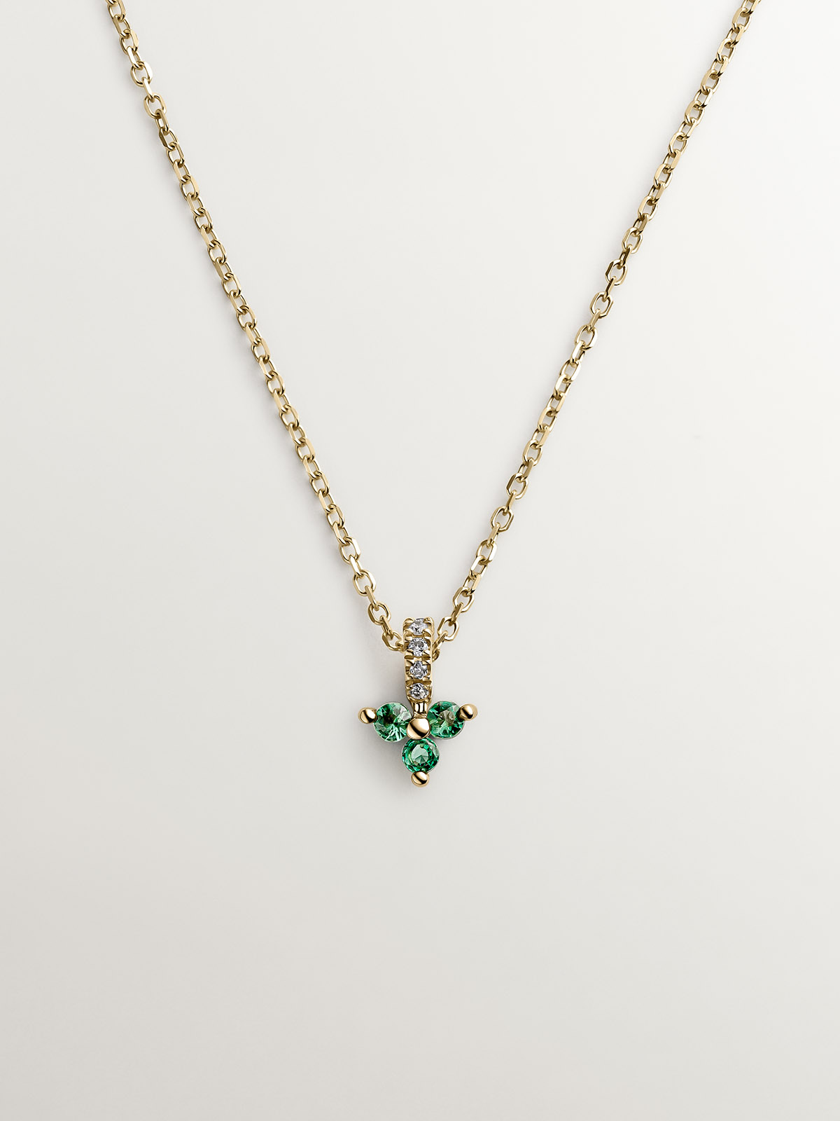 9K yellow gold pendant with emerald and diamond clover