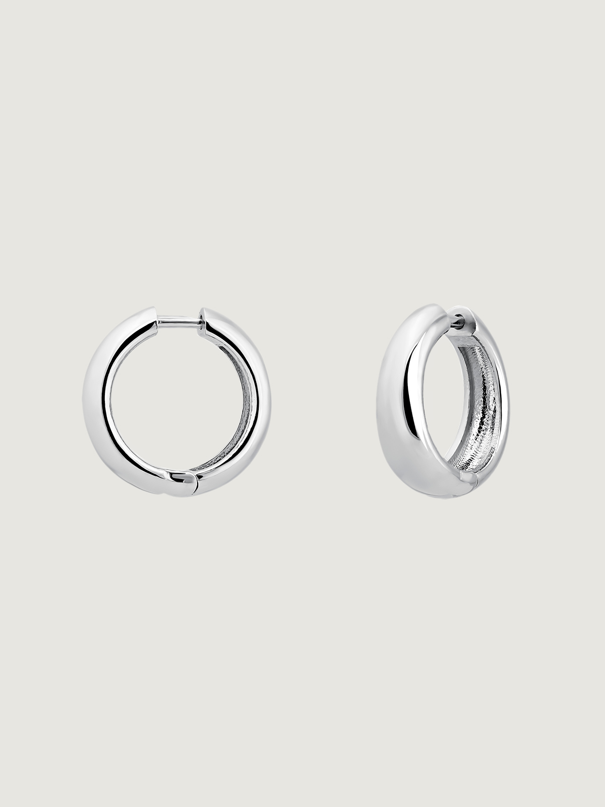 Medium thick 925 silver hoop earrings.