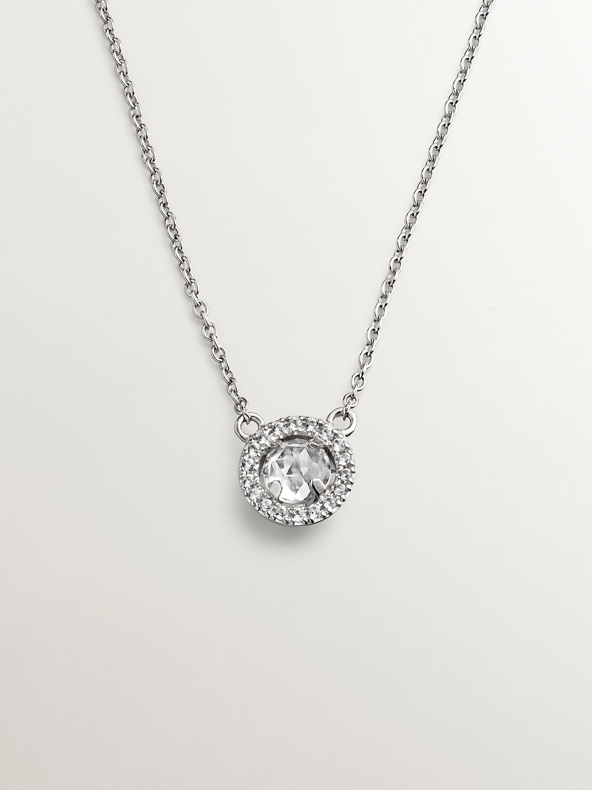 925 Silver Pendant with white topaz and border of white sapphires.