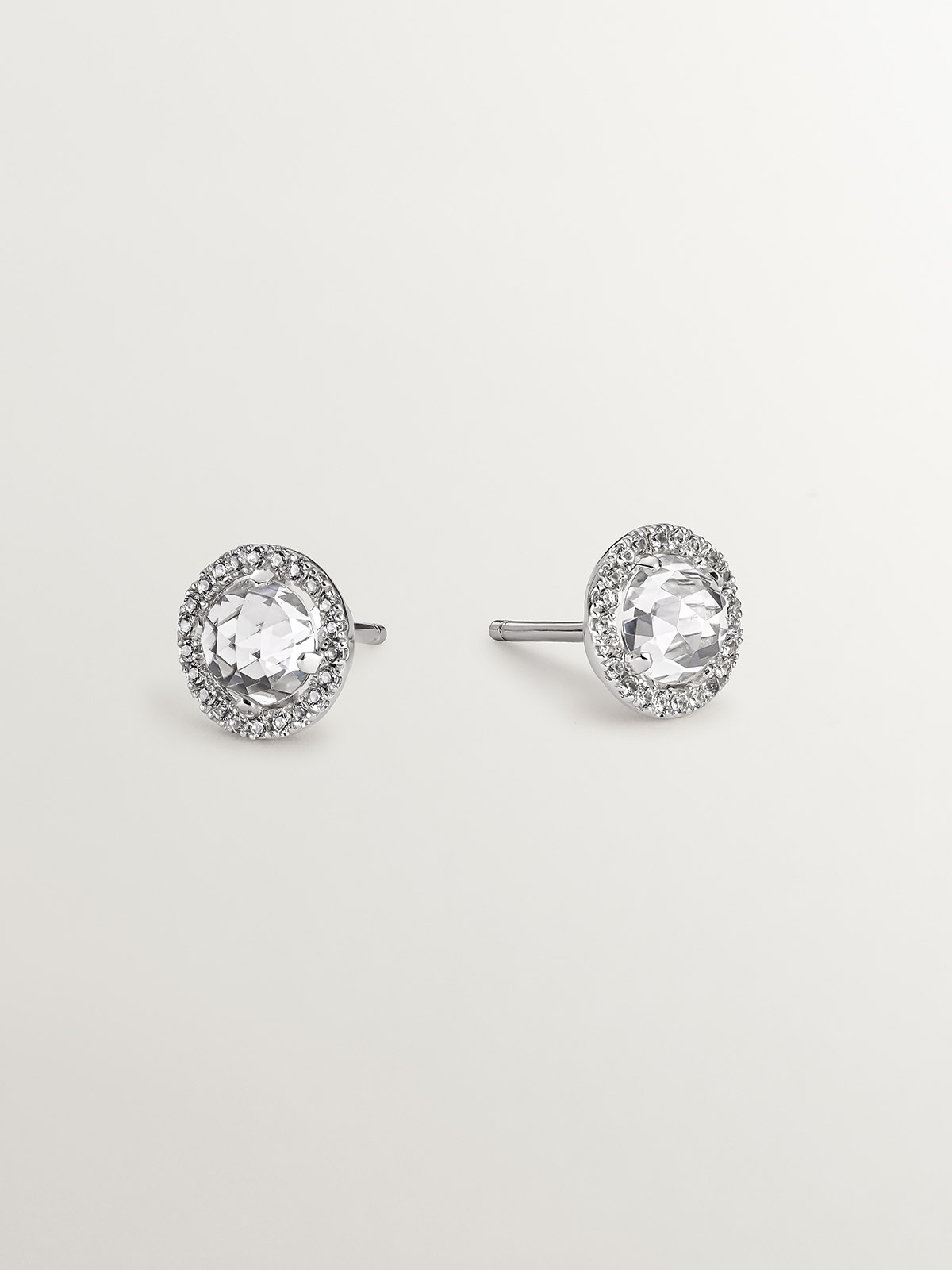 925 silver button earrings with white topaz and a halo of white sapphires.