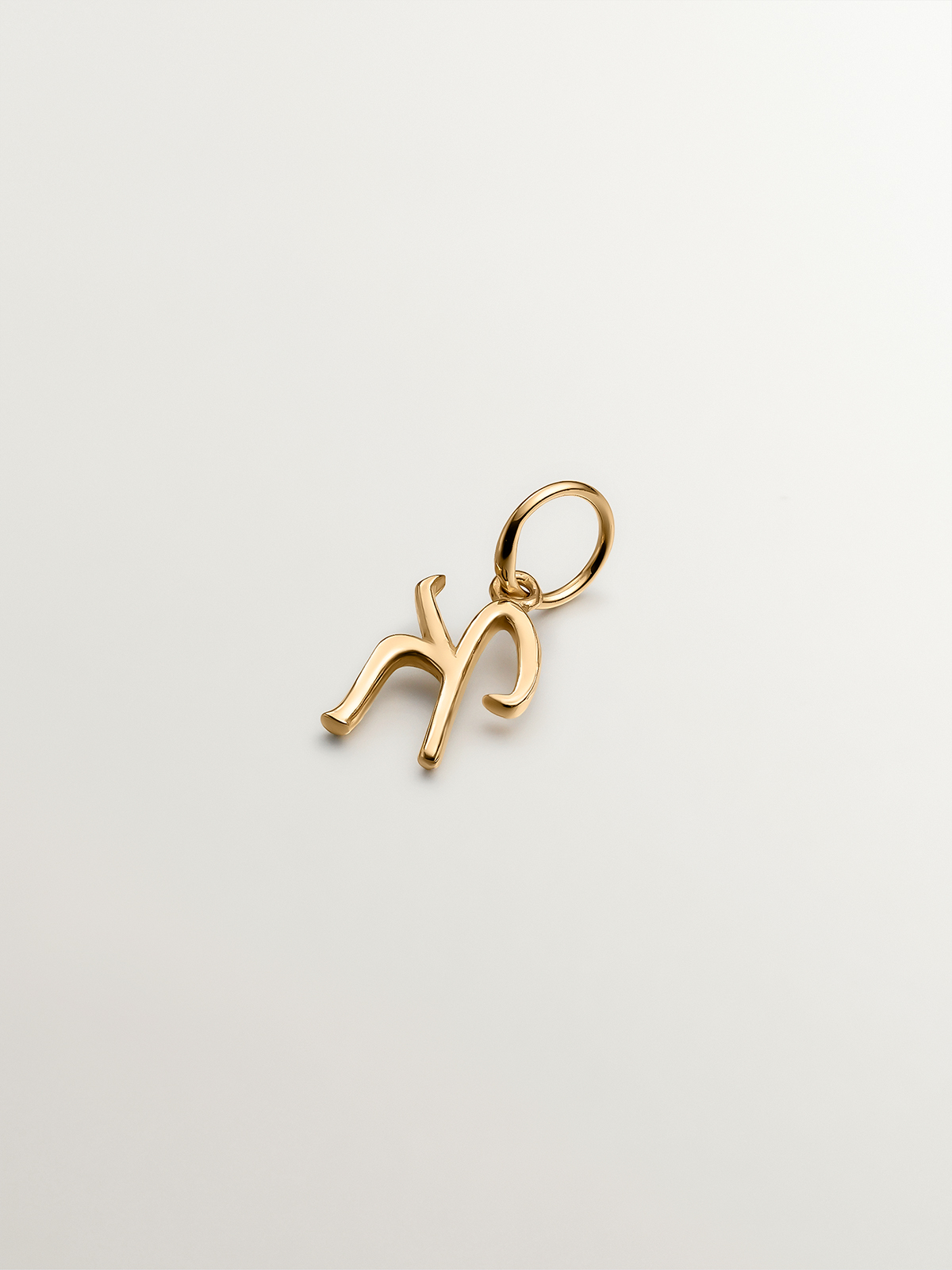 925 Silver charm bathed in 18K yellow gold with initial K.