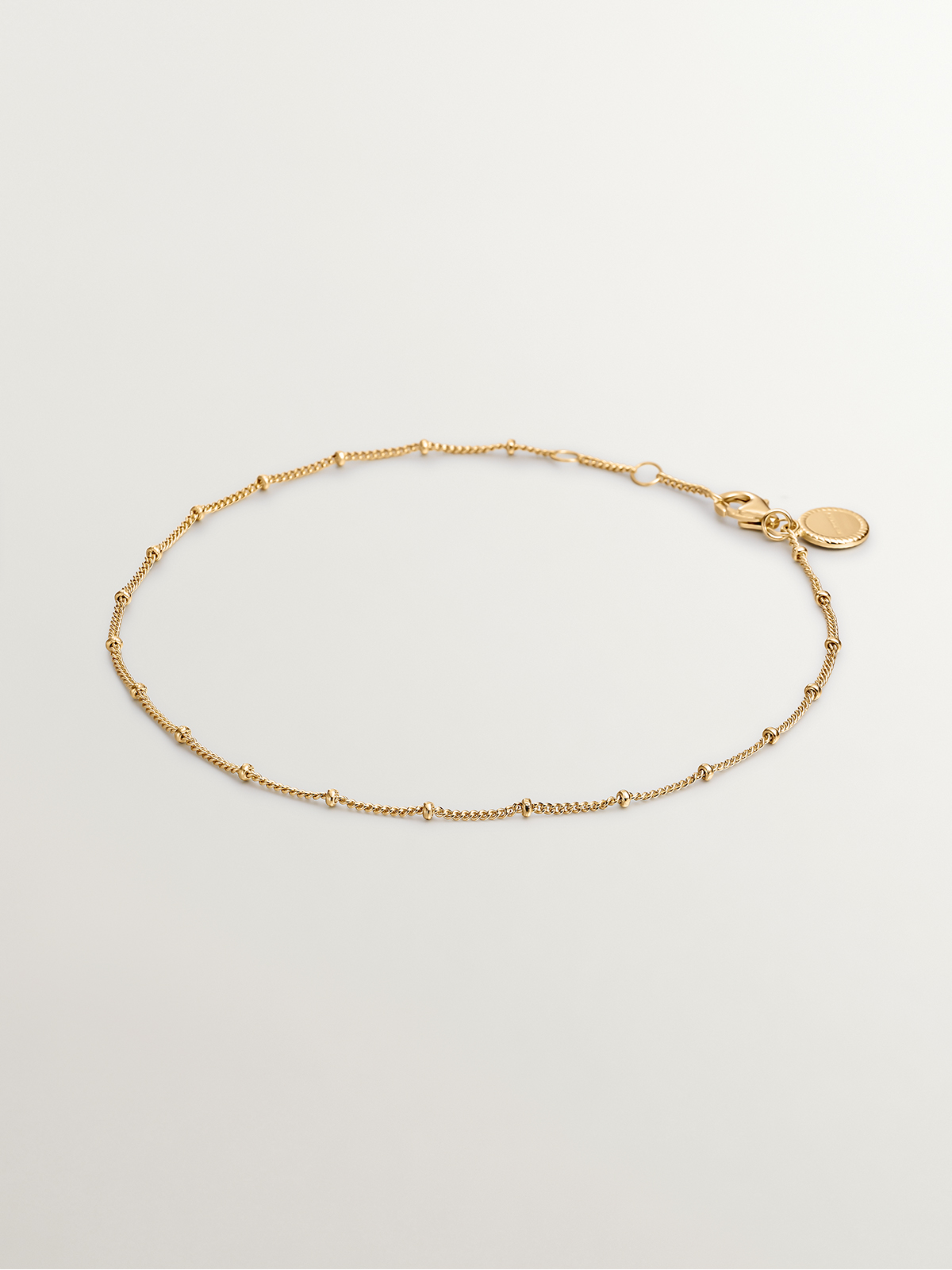 925 Silver anklet bathed in 18K yellow gold with beads.