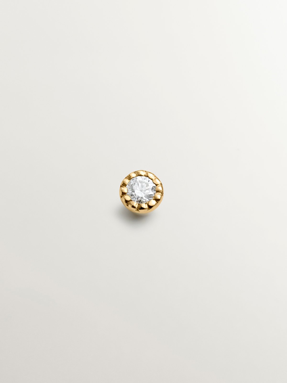 Individual 18K yellow gold piercing with diamond