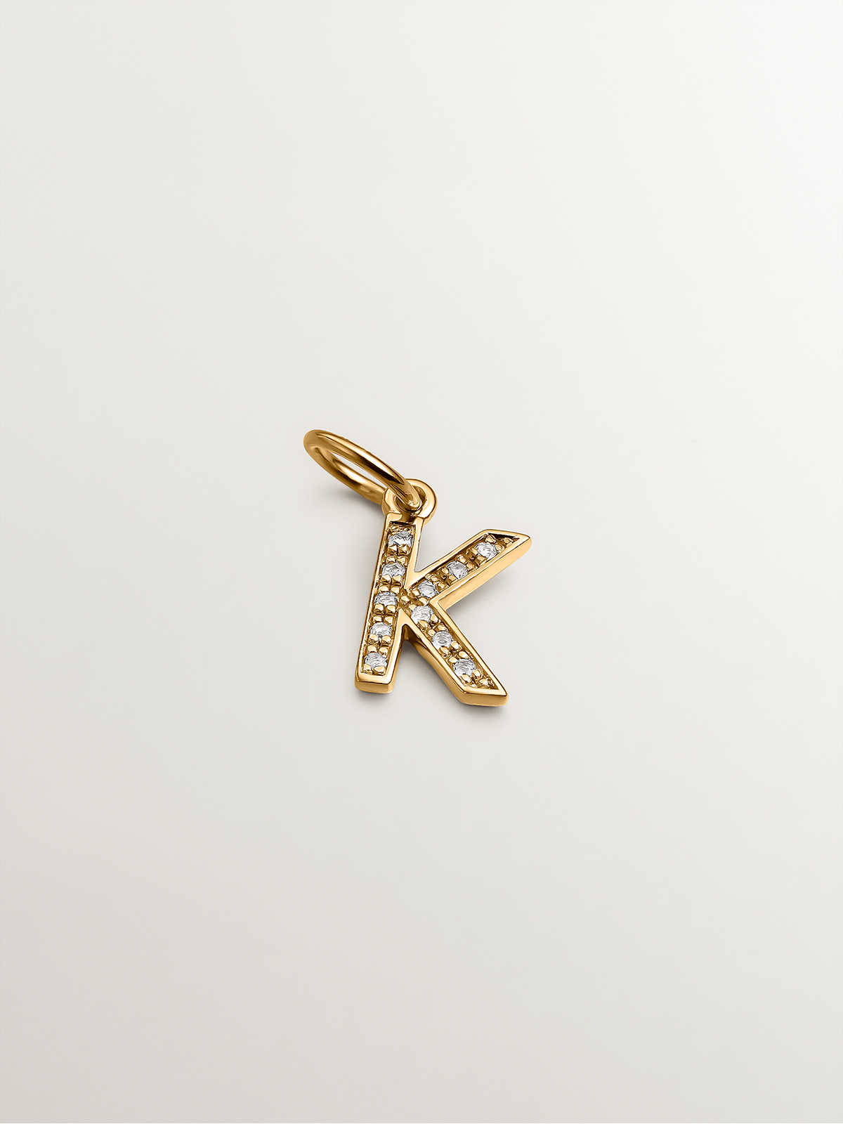 925 Silver charm bathed in 18K yellow gold and white topaz initial K