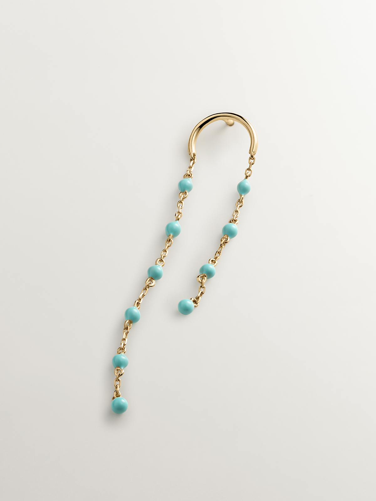 Individual long 9K yellow gold earring with chain and turquoise enamel beads.