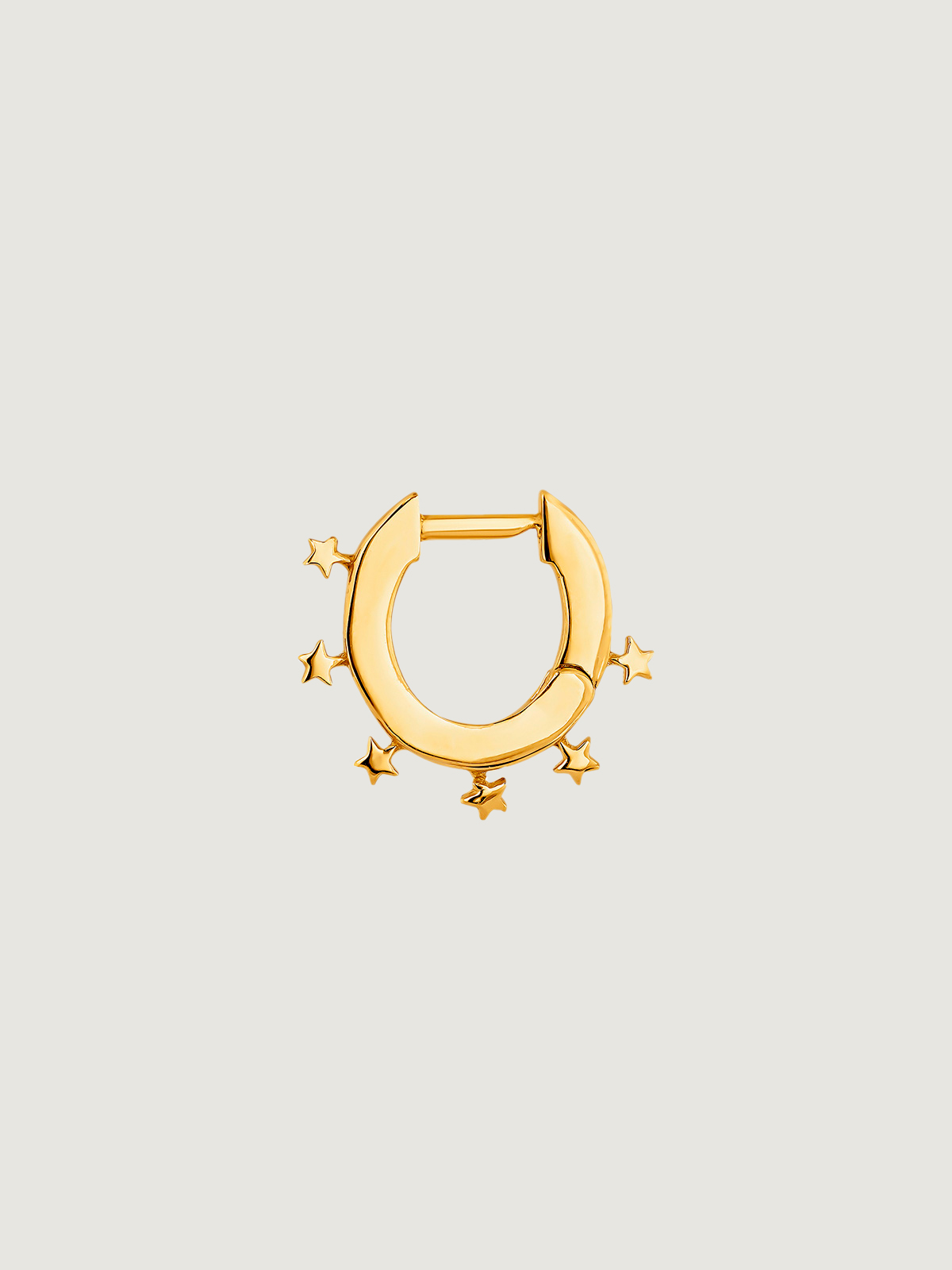Individual small hoop earring made of 925 silver, bathed in 18K yellow gold with stars.