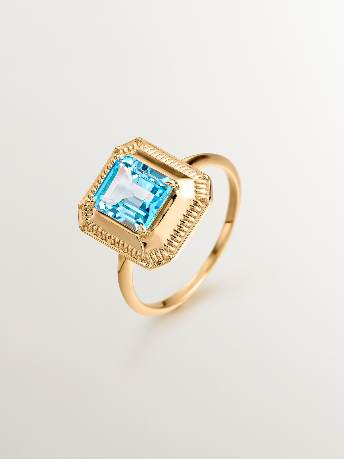 925 Silver ring bathed in 18K yellow gold with Swiss blue topaz