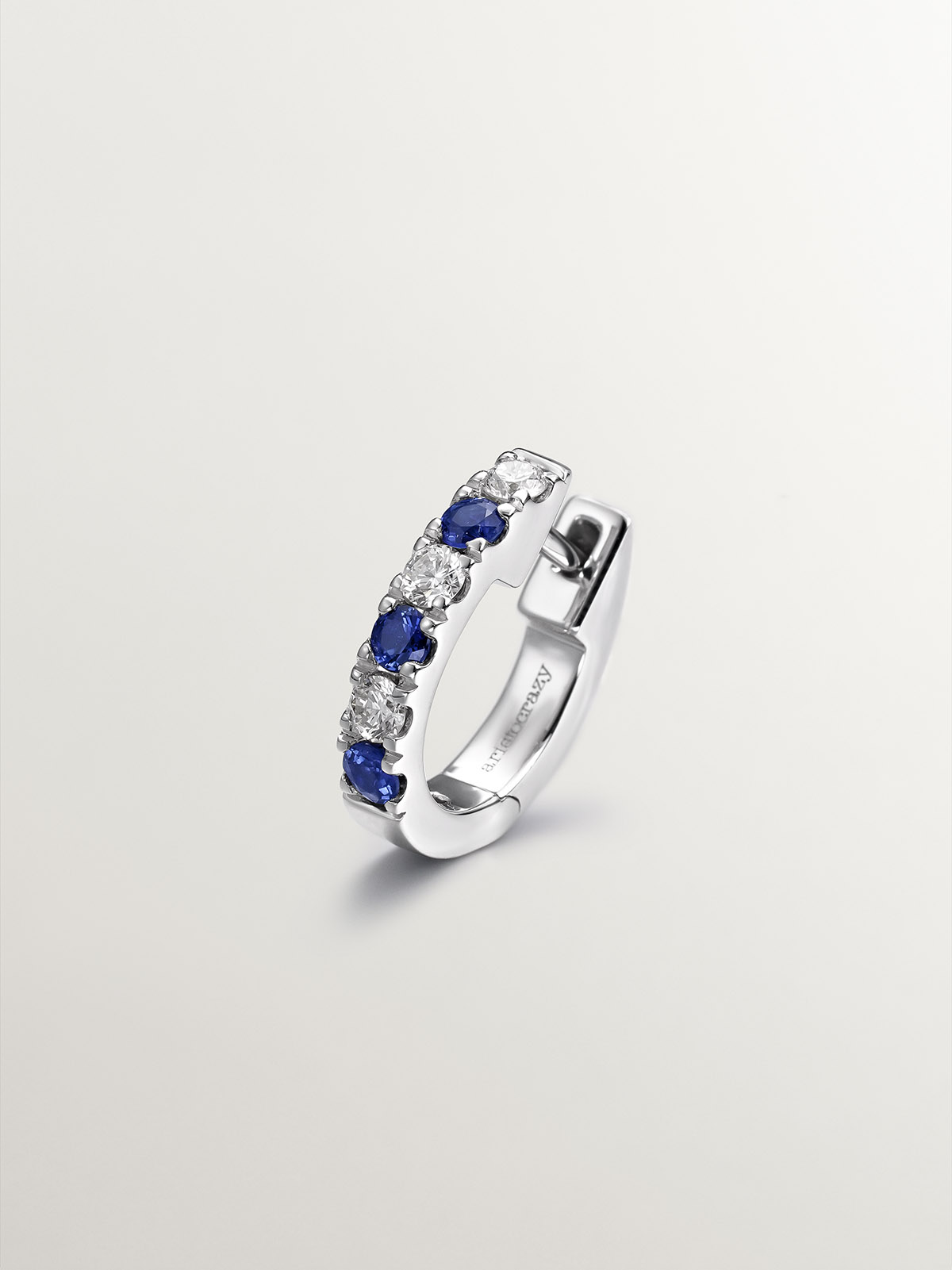 Individual small 9K white gold hoop earring with blue sapphires and diamonds