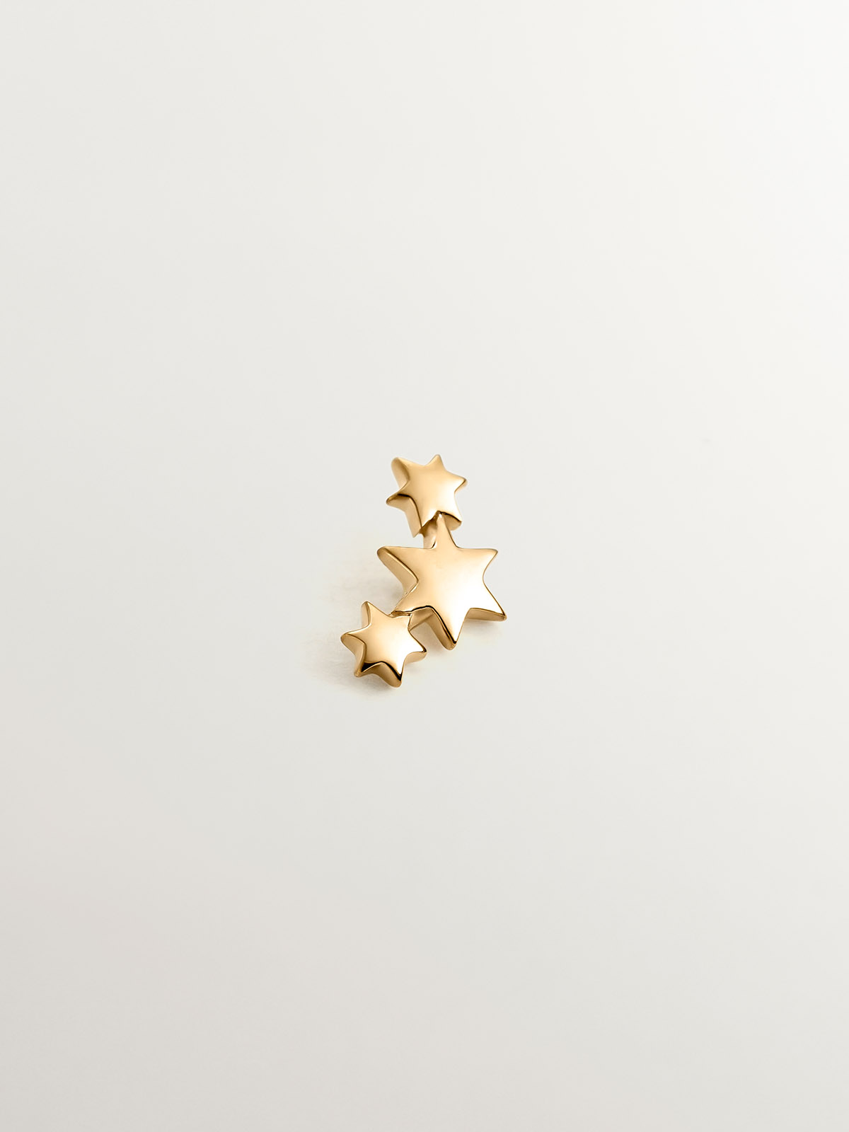 Piercing de oro amarillo de 18K con triple estrella