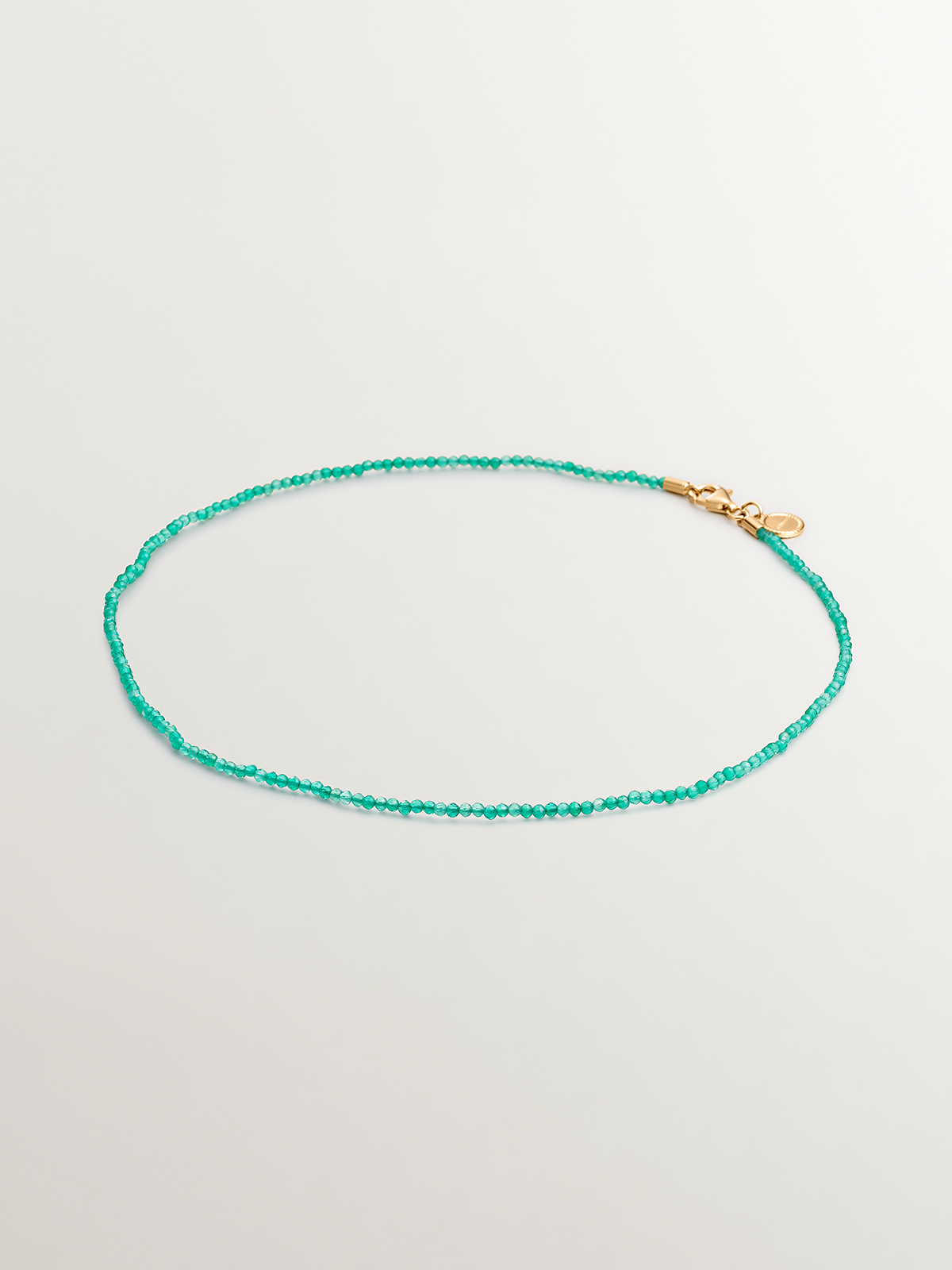 925 Silver necklace bathed in 18K yellow gold with green onyx beads.