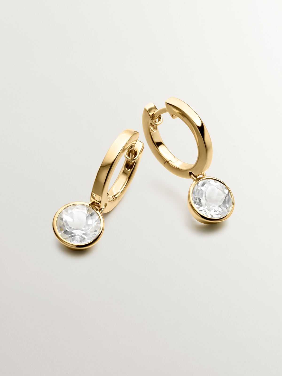 925 silver hoop earrings bathed in 18K yellow gold with white topaz