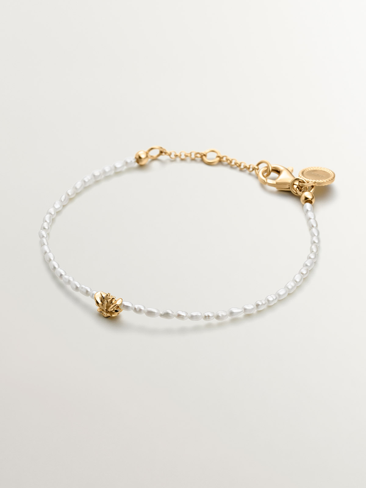 River pearl bracelet with 925 silver lotus flower coated in 18K yellow gold.
