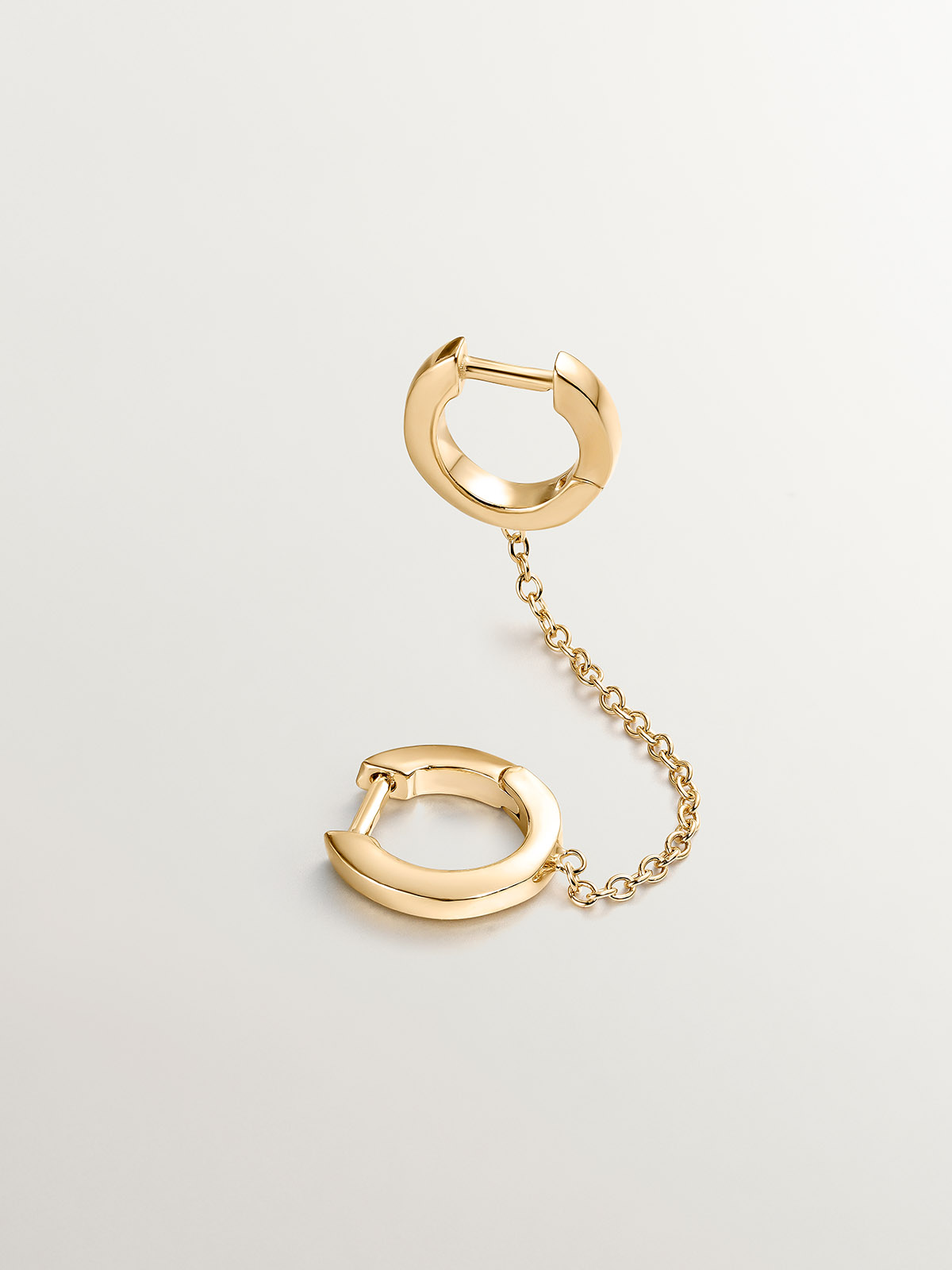 Individual climbing earring made from 925 silver, bathed in 18K yellow gold with a double hoop.