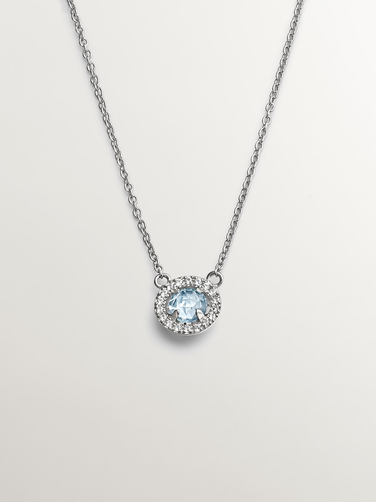 925 Silver necklace with blue topaz and white sapphires.