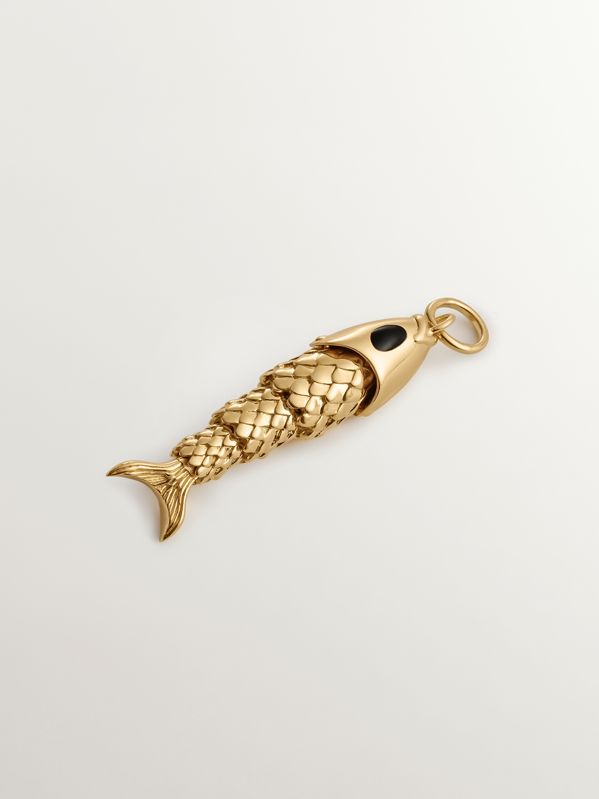 925 Silver charm bathed in 18K yellow gold with black enamel and fish shape.