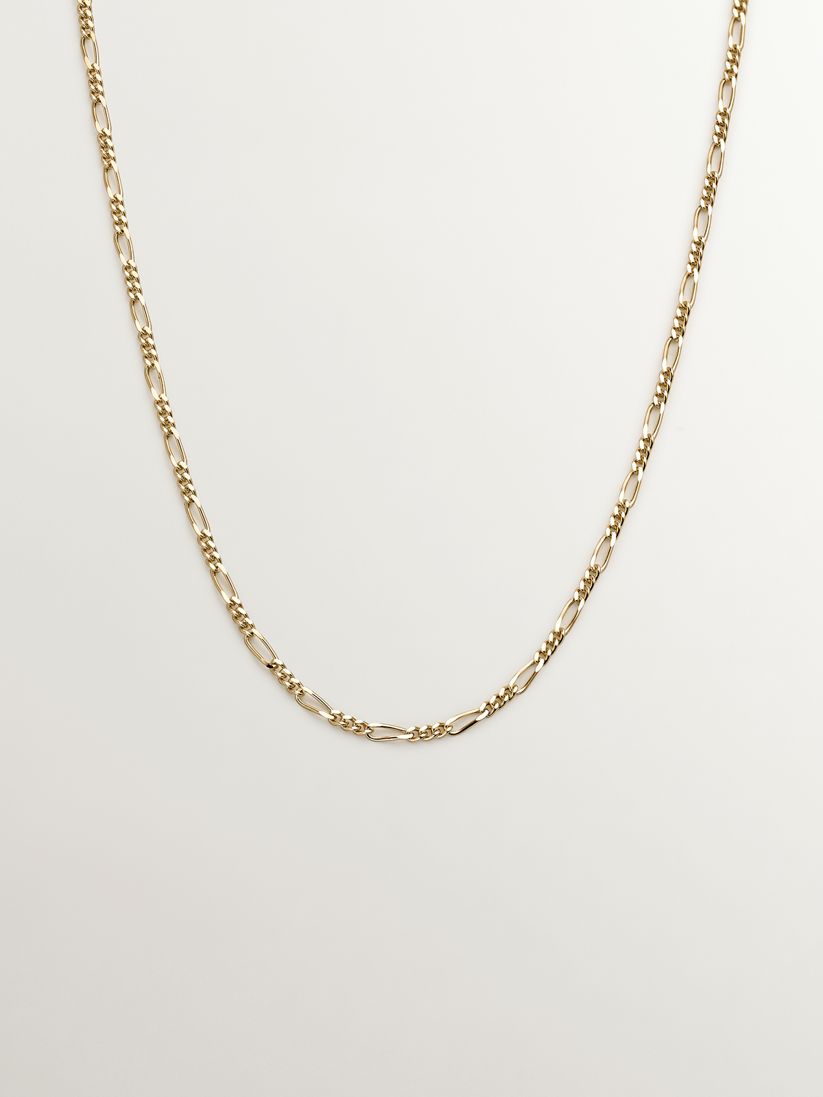 Fine Figaro link chain in 9K yellow gold