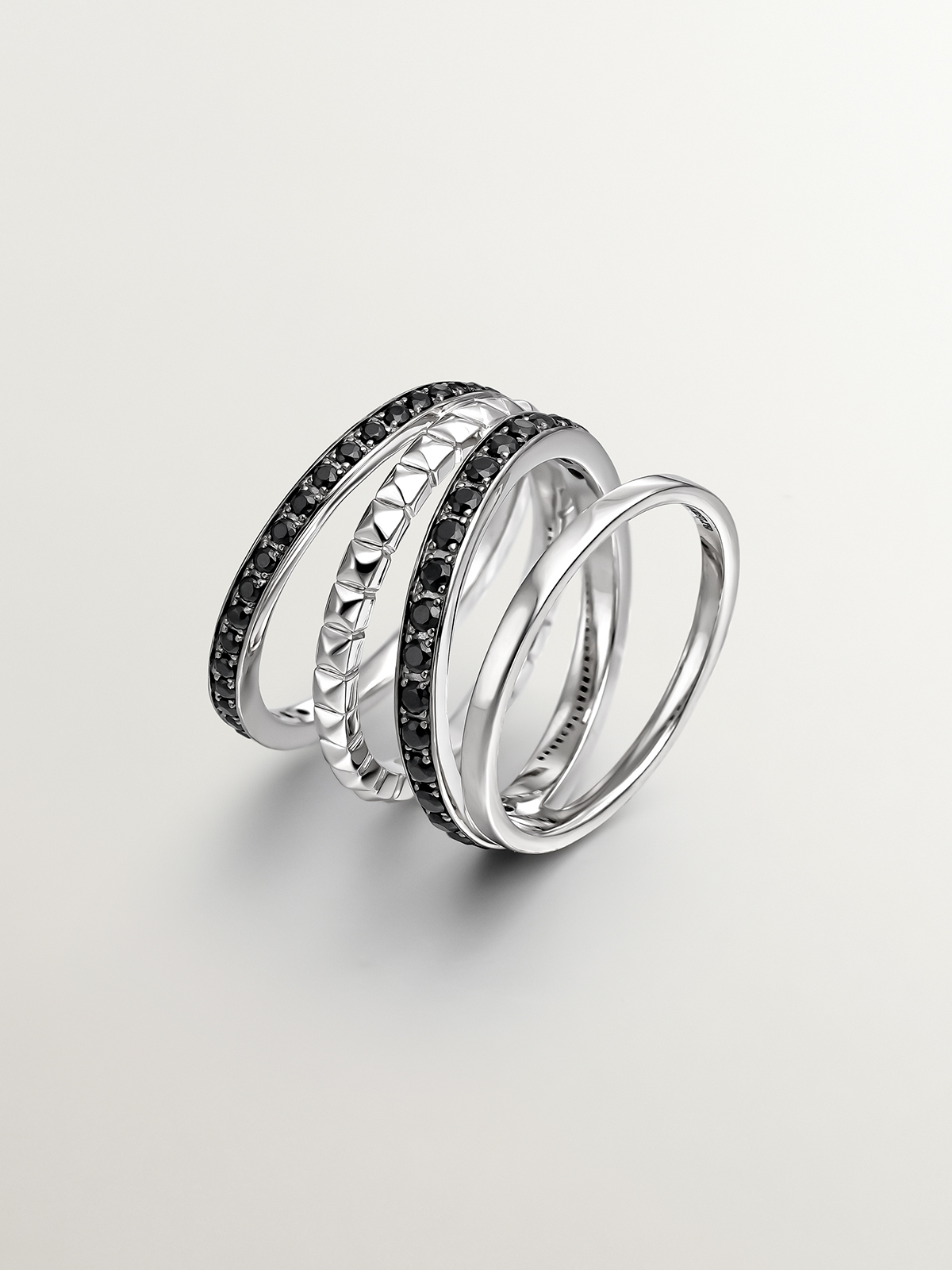 925 Silver Multi-Arm Ring coated with relief and black spinels.