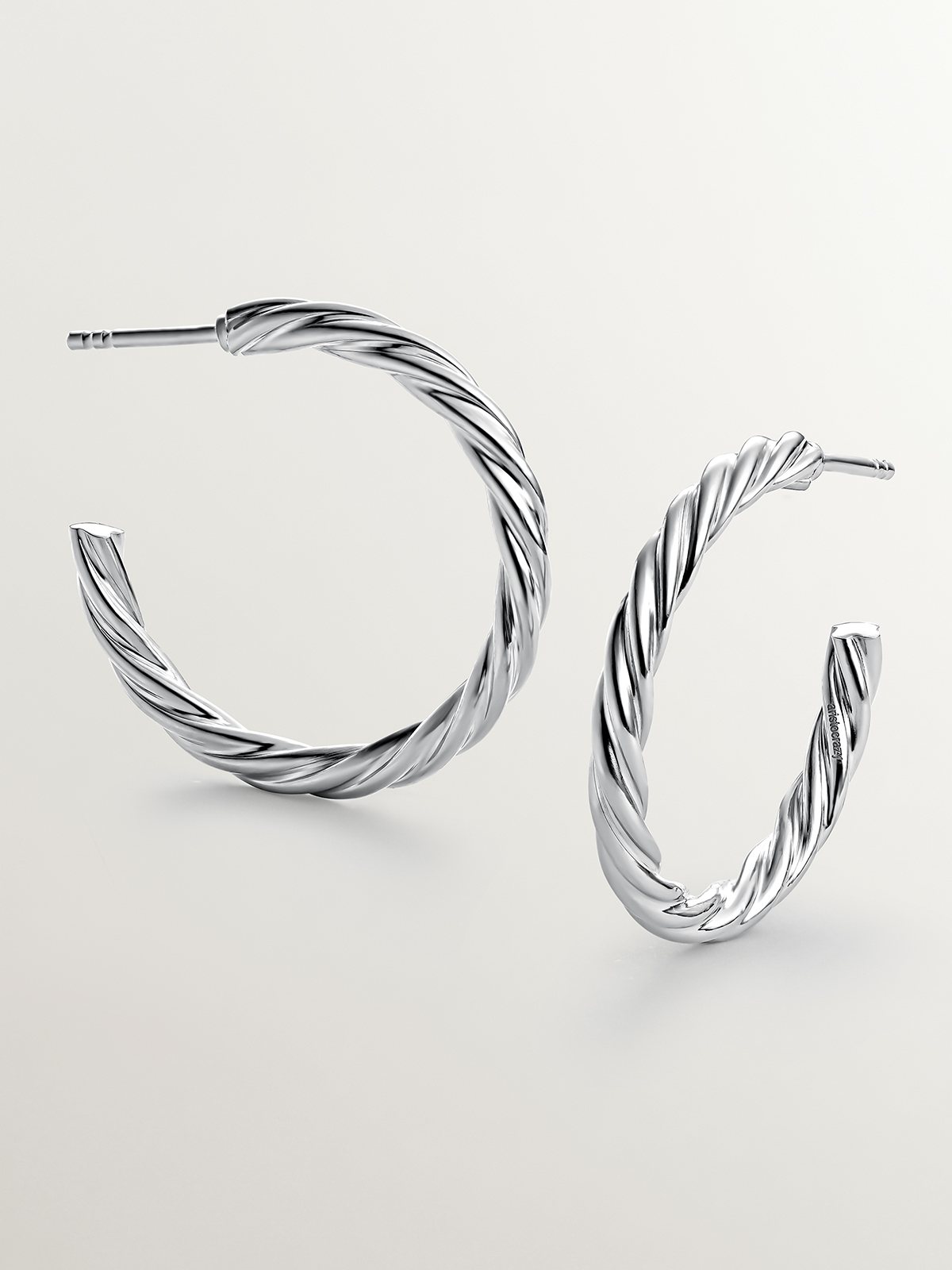 Large 925 sterling silver hoop earrings with fluted texture.