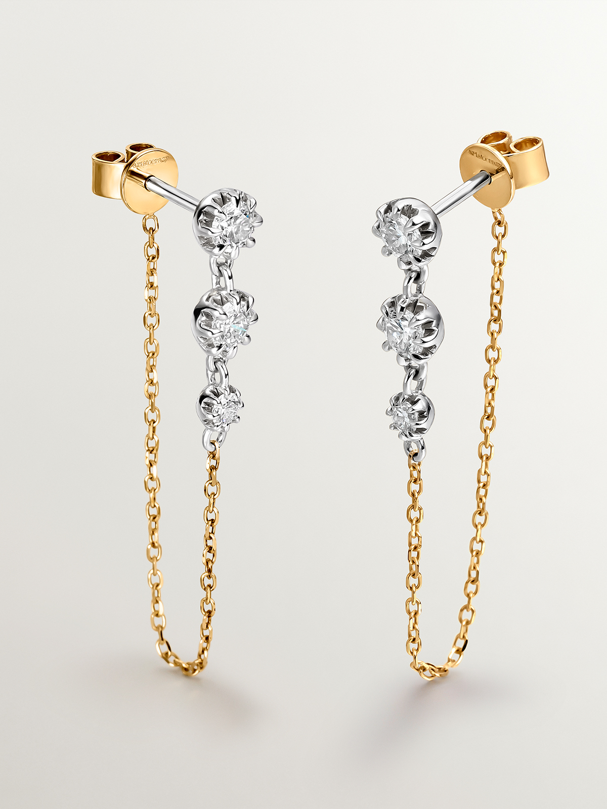 18K white and yellow gold earrings with brilliant cut diamonds