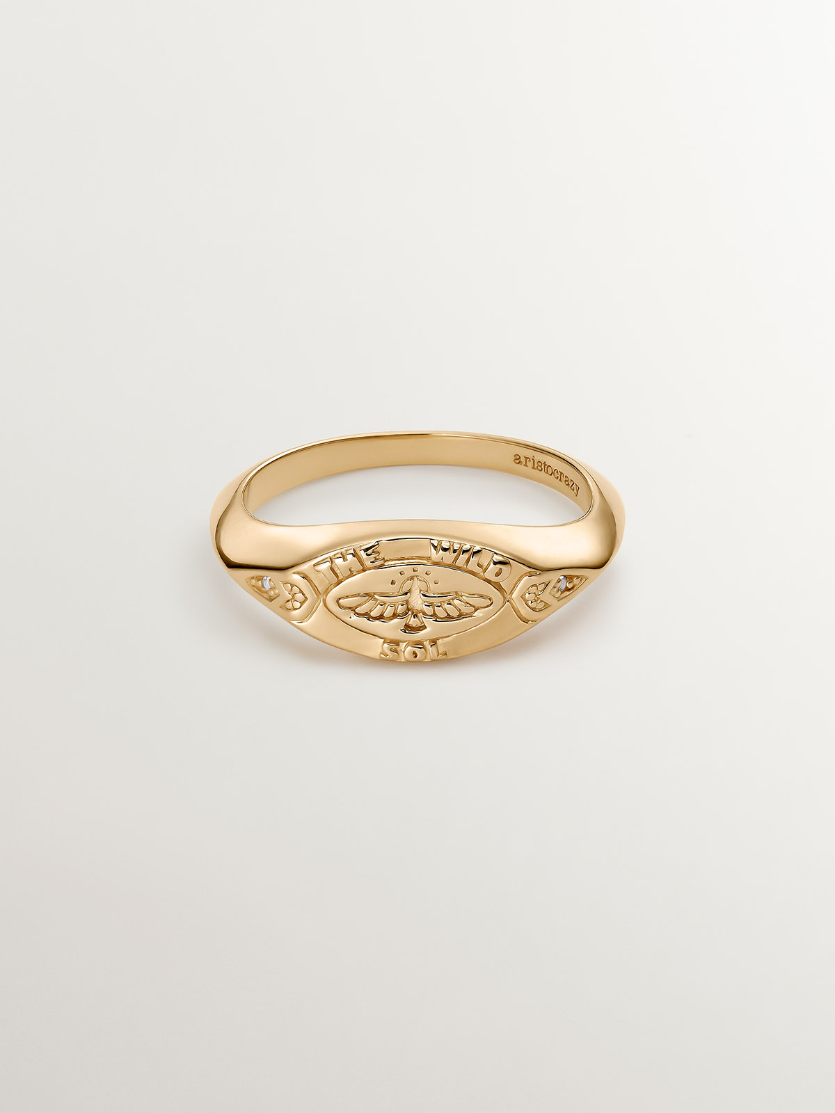 925 Silver seal ring bathed in 18K yellow gold with white topaz and eagle.